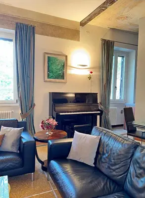 a living room with a couch and a table at Vatican Prestige - Meospiti Cesare Exclusive in Rome