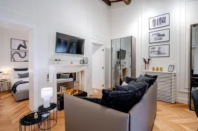 a living room with a couch and a fireplace at Acque Romane Piazza di Spagna in Rome