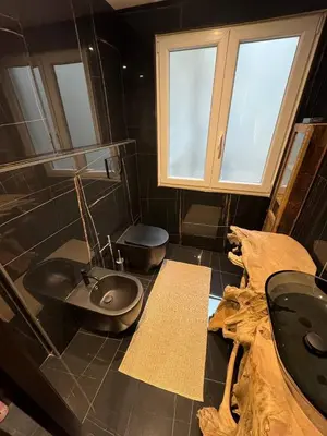 a bathroom with a sink and a toilet at Mata Vatican Rooms in Rome