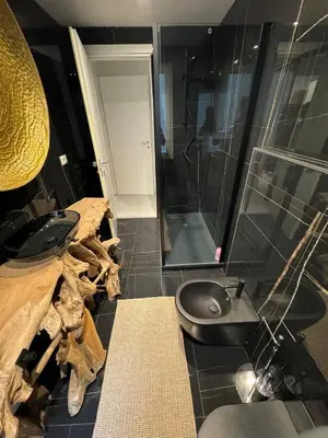 a bathroom with a shower and a sink and a toilet at Mata Vatican Rooms in Rome