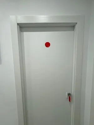 a red door with a red door knob on it at Mata Vatican Rooms in Rome