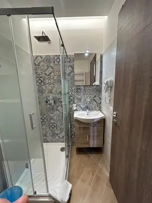 a bathroom with a shower and a sink at Grimaldi Comfort Guest House in Rome