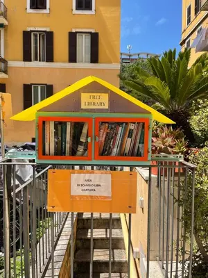 a book library with a yellow and orange roof at Steph and Lorenzo's place in Rome