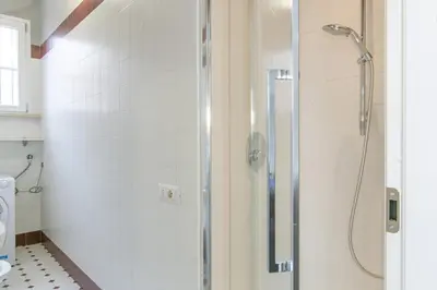 a shower with a glass door in a bathroom at La Terrazza di Vigna Clara in Rome
