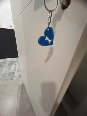 a key chain on a door with a arrow in it at Dolce Titina Affittacamere in Rome