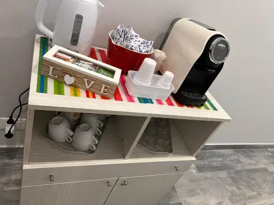 a wooden shelf with some items on it at Dolce Titina Affittacamere in Rome