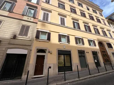 a large building with windows on a city street at Rome luxury blue suites- IMPERIAL in Rome