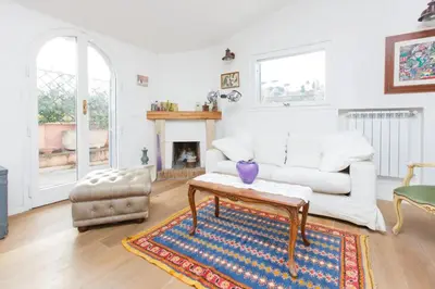 a living room with a white couch and a table at Sales in Rome
