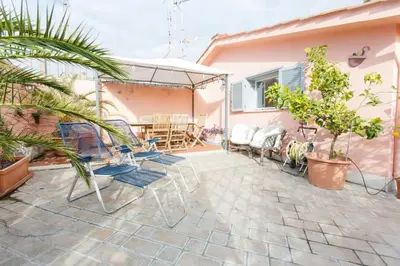 a patio with chairs and tables in a house at Sales in Rome
