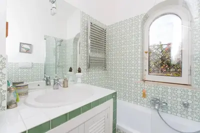 a bathroom with a sink and a mirror at Sales in Rome