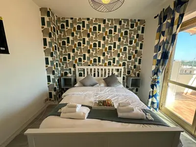 a bedroom with a large bed with towels on it at Attico al Settimo Piano in Rome