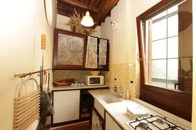 a kitchen with a sink and a microwave at Bollo Studio in Rome