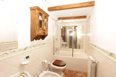 a bathroom with a toilet and a shower and a sink at Bollo Studio in Rome