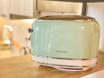 a green toaster sitting on top of a kitchen counter at Velabro Luxury Loft in Rome
