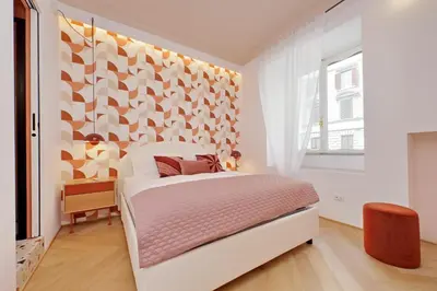 a white bedroom with a bed and a window at YCH-Colorful and classy apartment near Fori Imperiali in Rome