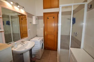 a bathroom with a sink and a shower and a toilet at Casa Vacanze Zio Gionni in Rome