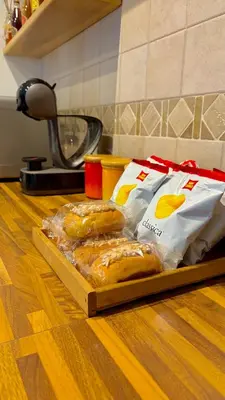 two bags of bread on a cutting board on a counter at Vatican Terrace Apartment in Rome