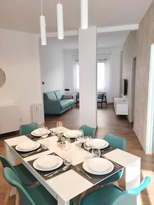 a dining room with a table and chairs at RomeBestHome Beccaria - Piazza del Popolo in Rome