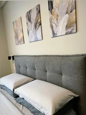 a bed with three pictures on the wall at Vatican - Angolo di Roma in Rome