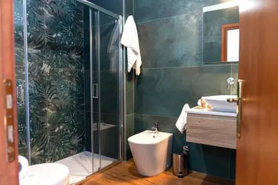 a bathroom with a sink and a mirror at Wild Luxury Home in Rome