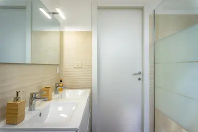 a bathroom with a sink and a mirror at Pamphili Rooms in Rome