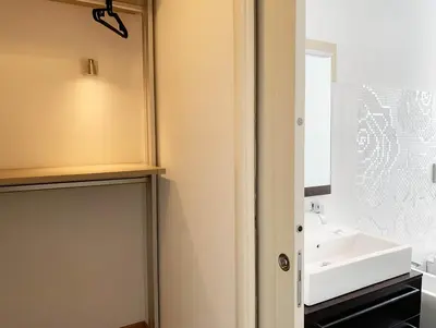 a bathroom with a sink and a mirror at DaliTourism - Vatican Apartment 77 in Rome