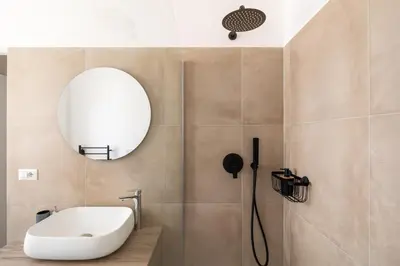 a bathroom with a sink and a mirror at Vatican Clodio Suites in Rome