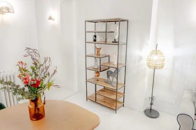 a room with a table with a vase of flowers at Minerva boutique residence 4 in Rome