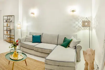 a living room with a couch and a table at Minerva boutique residence 4 in Rome