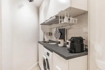 a small kitchen with a sink and a microwave at Scipioni Vatican Studio distante 10 minuti a piedi dal Vaticano in Rome