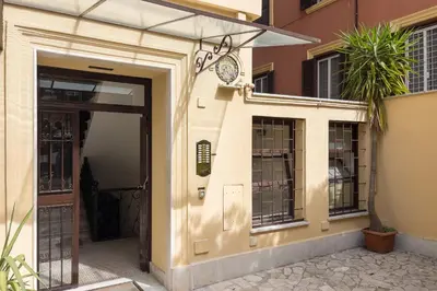 an entrance to a building with an open door at Scipioni Vatican Studio distante 10 minuti a piedi dal Vaticano in Rome