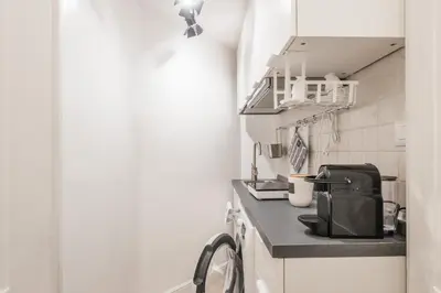 a small kitchen with a counter and a sink at Scipioni Vatican Studio distante 10 minuti a piedi dal Vaticano in Rome