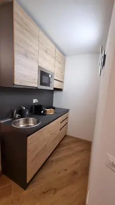 a bathroom with a sink and a microwave at Under Trastevere stars in Rome