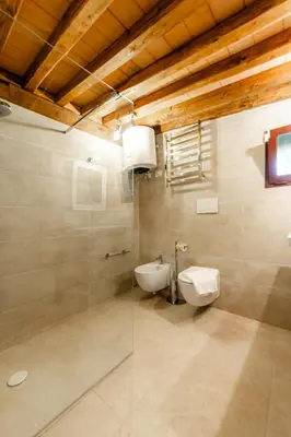 a bathroom with a toilet and a sink at Appia Antica Country House giardino parcheggio Fermata bus in Rome