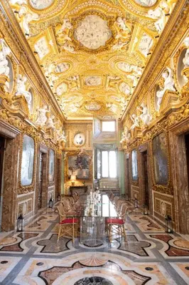 an ornate room with a long table and chairs at Palazzo Shedir - The Leading Hotels of the World in Rome
