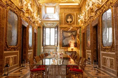 a long dining room with a long table and chairs at Palazzo Shedir - The Leading Hotels of the World in Rome