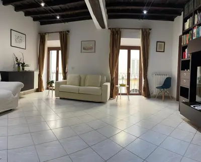 a living room with a couch and a table at Boschetto49 in Rome