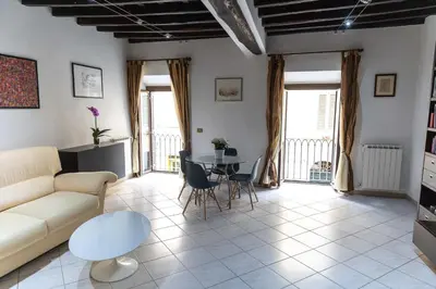 a living room with a couch and a table at Boschetto49 in Rome