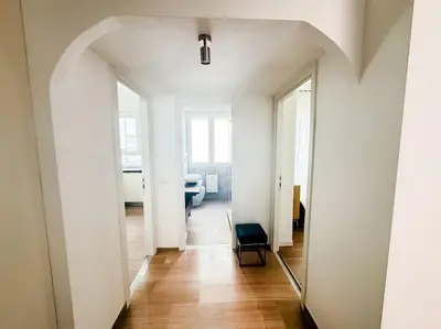 a hallway with a mirror and a chair in a room at ophelia apartment in Rome