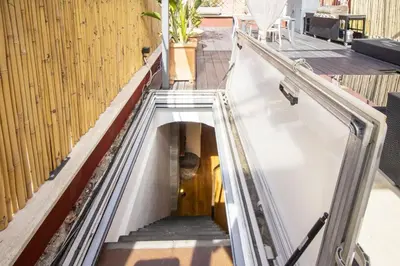 a stairwell in a building with a yellow door at Scuderie San Lorenzo in Rome