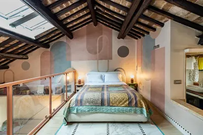 a bedroom with a bed on a balcony at Altiora - Luxury loft in Trastevere, Rome in Rome
