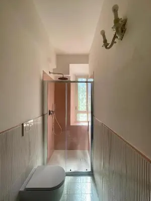 a bathroom with a toilet and a shower at Casetta Roma San Giovanni in Rome