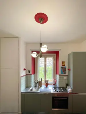 a kitchen with a sink and a red ceiling at Casetta Roma San Giovanni in Rome