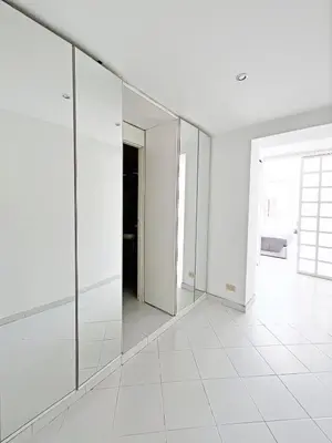 a white room with mirrors on the wall at Trevi over the top apartment in Rome