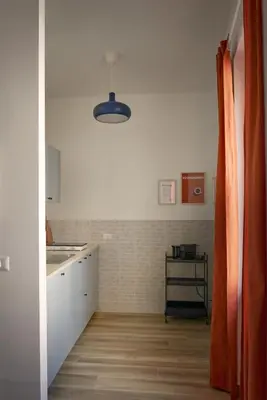 a kitchen with a sink and a counter top at Bivio - Casa Azzurra in Rome