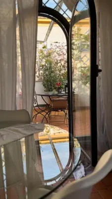 a view of a glass table and a patio at Attico Le Castelline in Rome