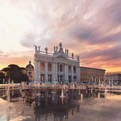 a large white building with a fountain in front of it at Attico Le Castelline in Rome