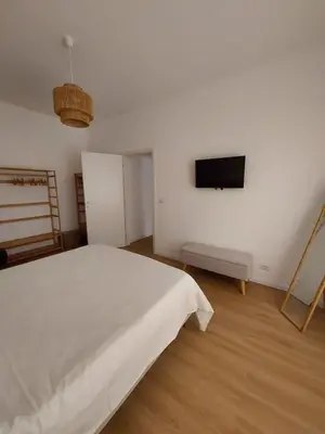 a bedroom with a bed and a tv on the wall at Interno 4 al Vaticano in Rome