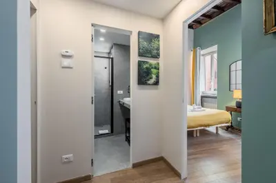 a room with a bathroom with a sink and a mirror at Sciampagne in Rome
