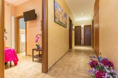 a bedroom with a bed with two towels on it at Starry Rome Guest House in Rome